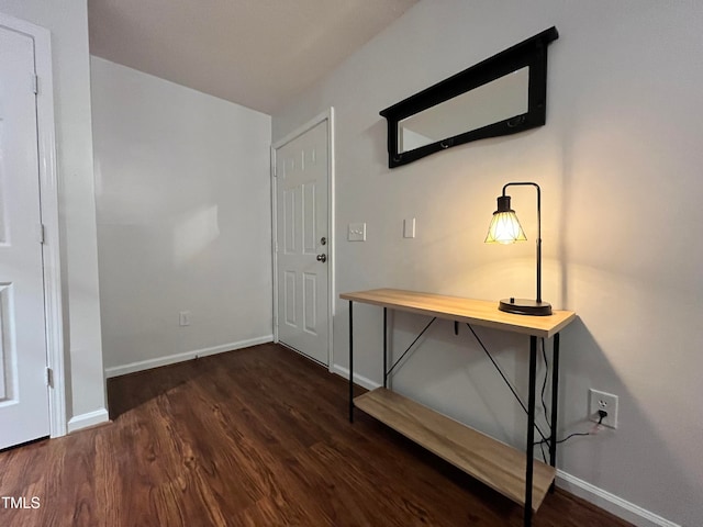 entryway with wood finished floors and baseboards