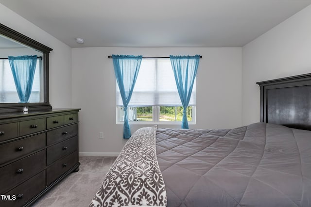 bedroom with light colored carpet