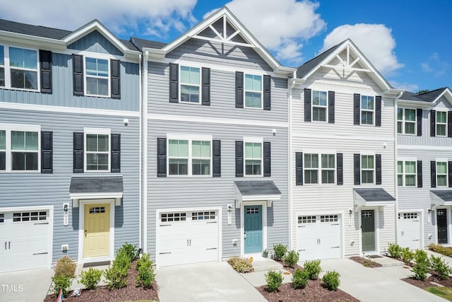 townhome / multi-family property featuring a garage