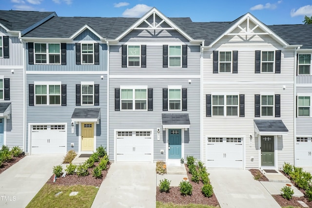 multi unit property featuring a garage