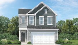 view of front facade with a front yard and a garage