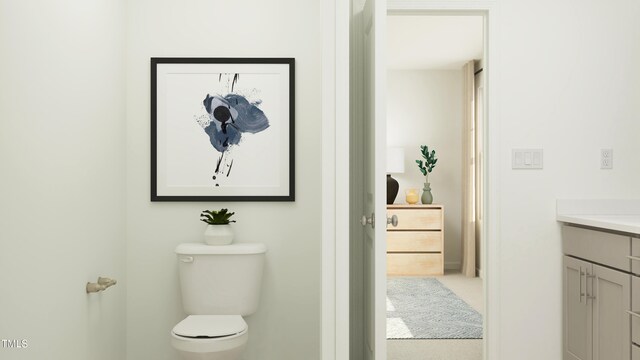 bathroom with vanity and toilet