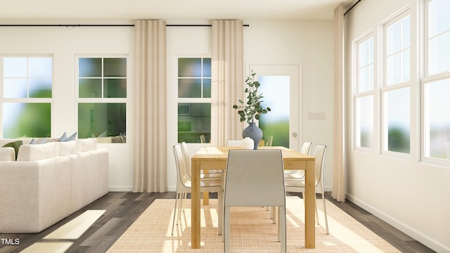 dining space with baseboards and dark wood-style flooring