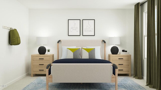 bedroom featuring baseboards and carpet