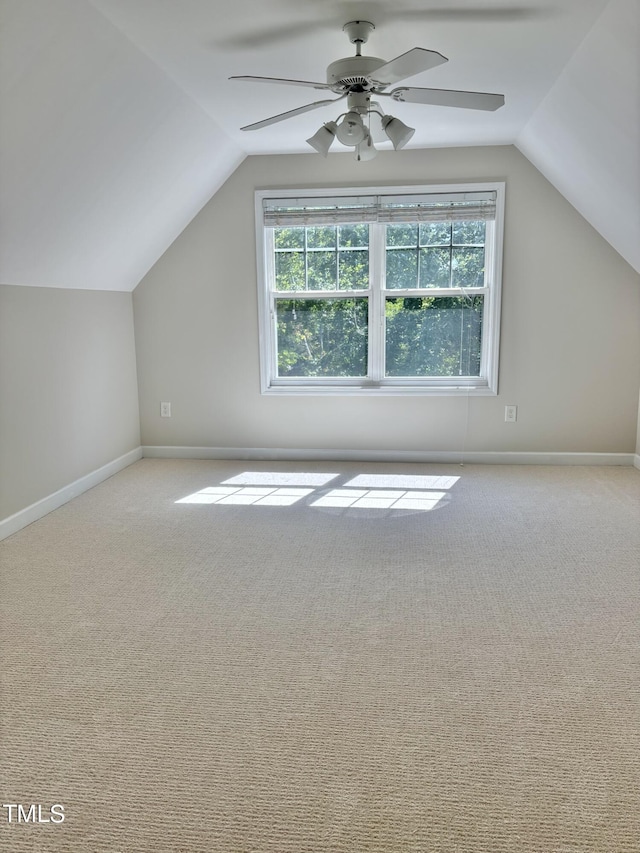 bonus room featuring light colored carpet, ceiling fan, and lofted ceiling