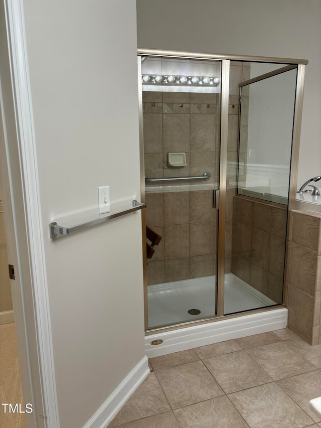 bathroom featuring tile patterned floors and walk in shower