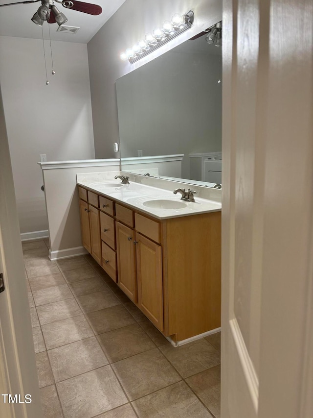 bathroom with ceiling fan and vanity