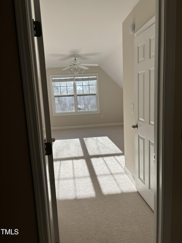 bonus room featuring carpet flooring, ceiling fan, and vaulted ceiling