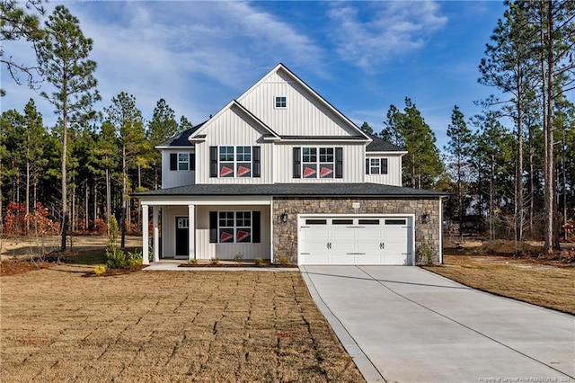 view of front of house featuring covered porch and a garage