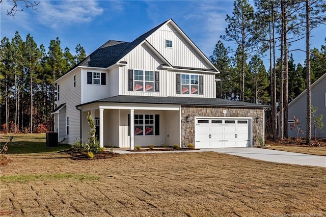 view of front of property with a front lawn and a garage