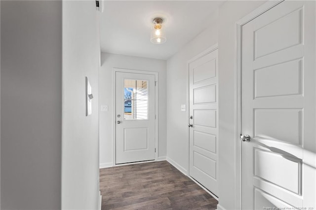 doorway with dark hardwood / wood-style floors