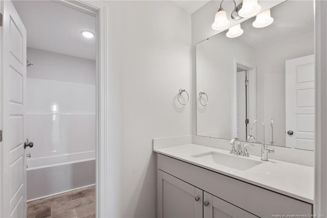 bathroom featuring shower / bathtub combination and vanity