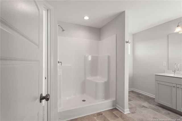 bathroom with vanity and walk in shower