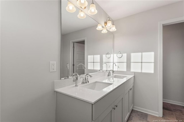 bathroom featuring an inviting chandelier and vanity