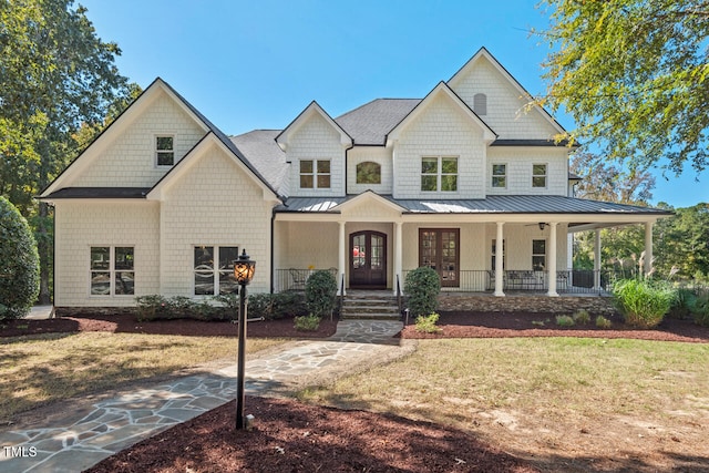 view of front of property with a front lawn and covered porch