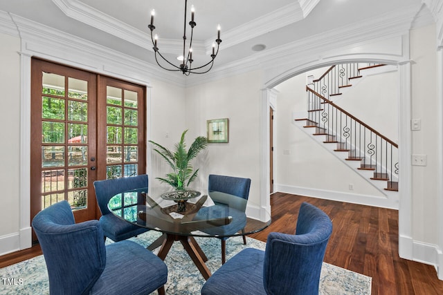 sitting room featuring french doors, dark hardwood / wood-style floors, a tray ceiling, and crown molding