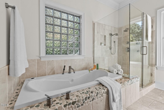 bathroom featuring crown molding and independent shower and bath