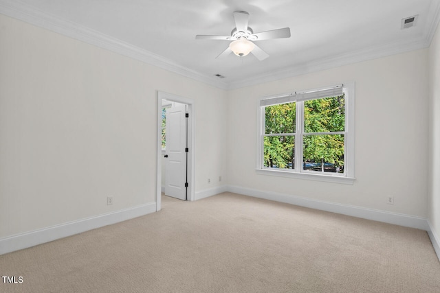 unfurnished room featuring light carpet, ornamental molding, and ceiling fan