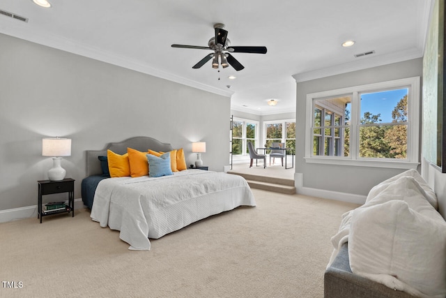 carpeted bedroom featuring crown molding and ceiling fan