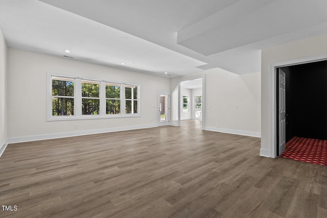 unfurnished living room featuring hardwood / wood-style floors