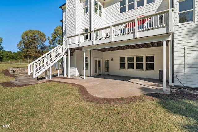 back of house with a patio, a deck, and a yard