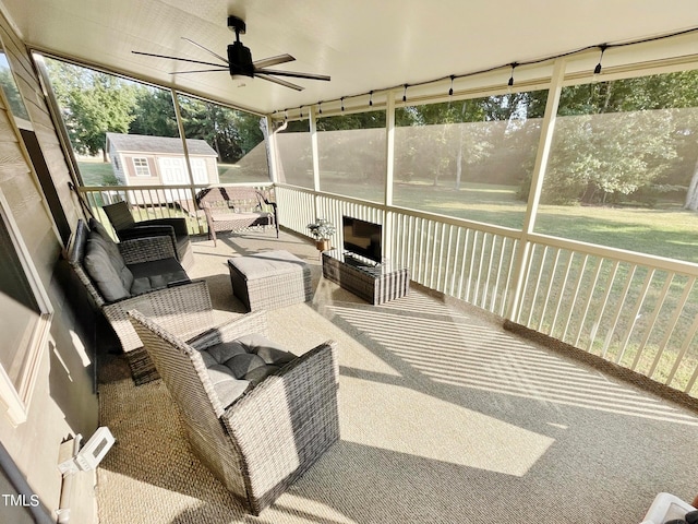 sunroom with plenty of natural light and ceiling fan