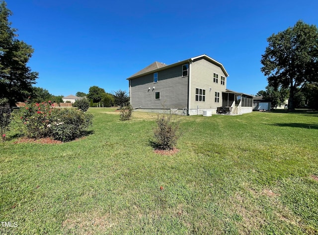 view of side of home featuring a lawn