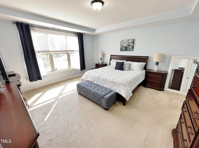 bedroom with light colored carpet