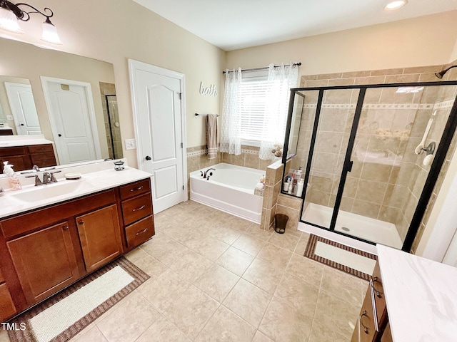 bathroom with vanity, shower with separate bathtub, and tile patterned floors