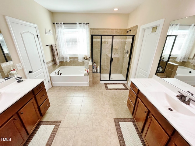 bathroom featuring vanity, tile patterned floors, and separate shower and tub