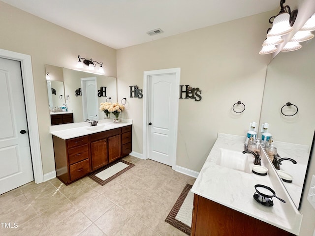 bathroom featuring vanity and tile patterned flooring