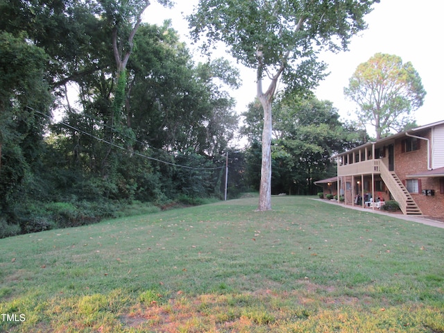 view of yard featuring a deck