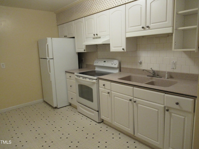 kitchen with sink, tasteful backsplash, white appliances, and white cabinetry