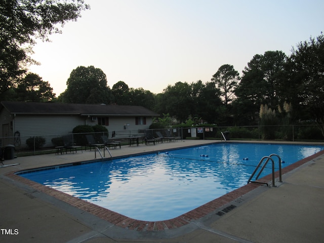 view of swimming pool featuring a patio