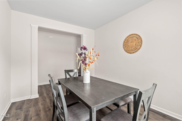 dining space featuring dark hardwood / wood-style floors