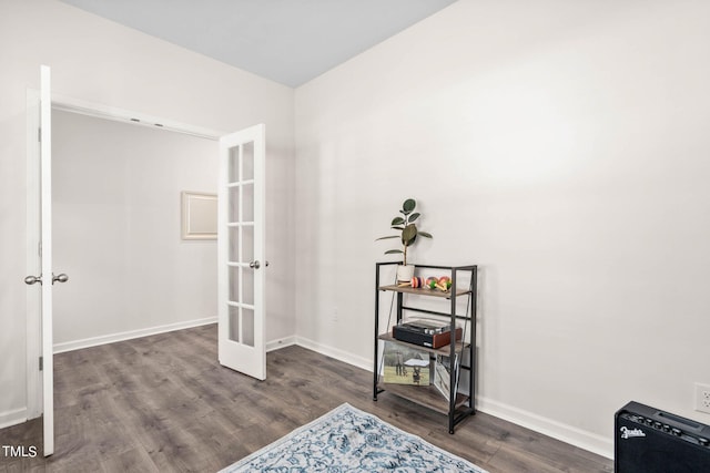 interior space with dark wood-type flooring and french doors