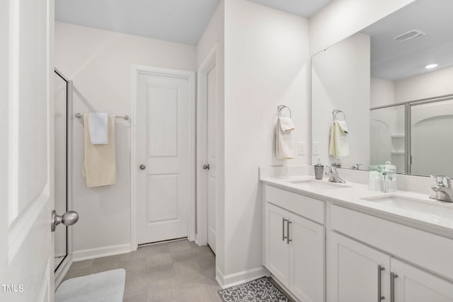 bathroom with an enclosed shower and vanity