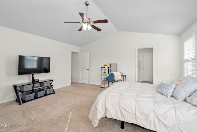 carpeted bedroom with vaulted ceiling and ceiling fan