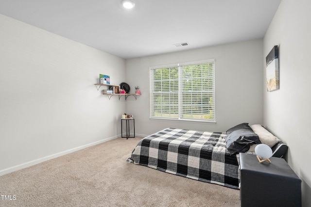 bedroom with light colored carpet