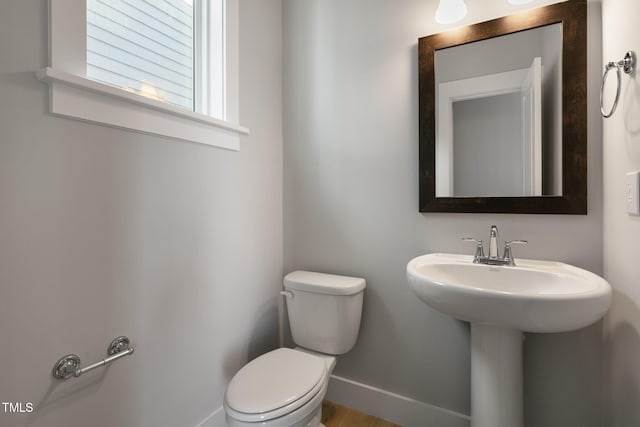 bathroom with toilet and sink