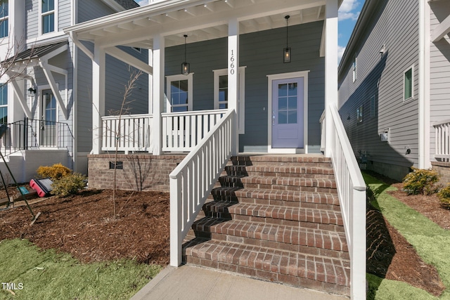 property entrance featuring a porch