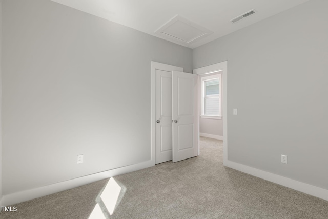 unfurnished bedroom with light carpet