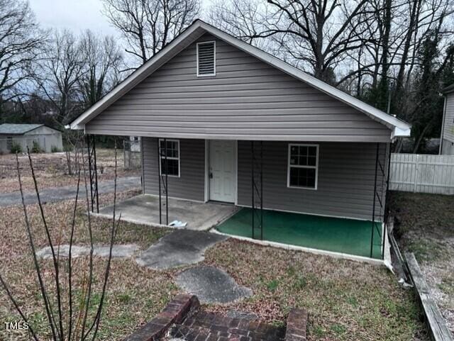 back of property featuring a patio