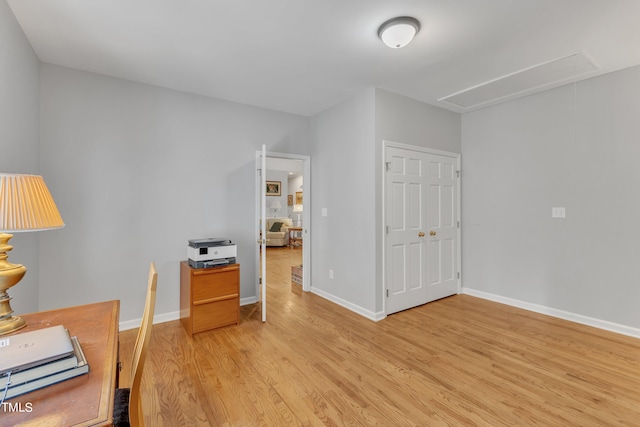 office with light hardwood / wood-style floors