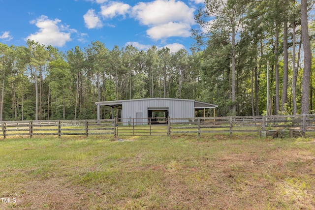 view of yard featuring a rural view and an outdoor structure