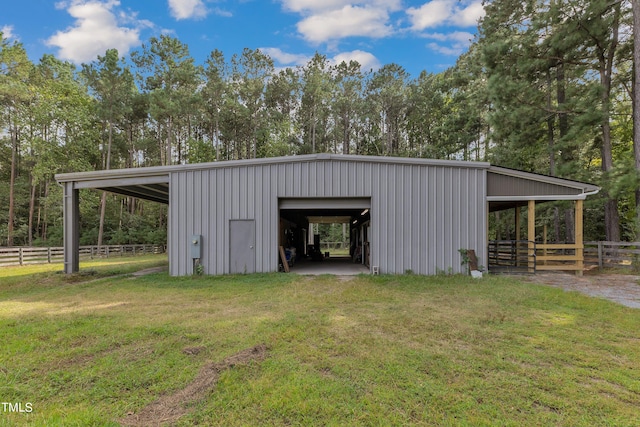 view of outbuilding featuring a yard