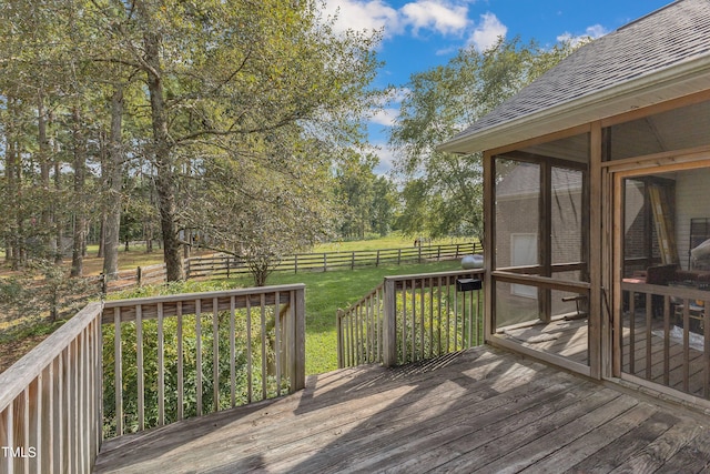 wooden deck with a sunroom