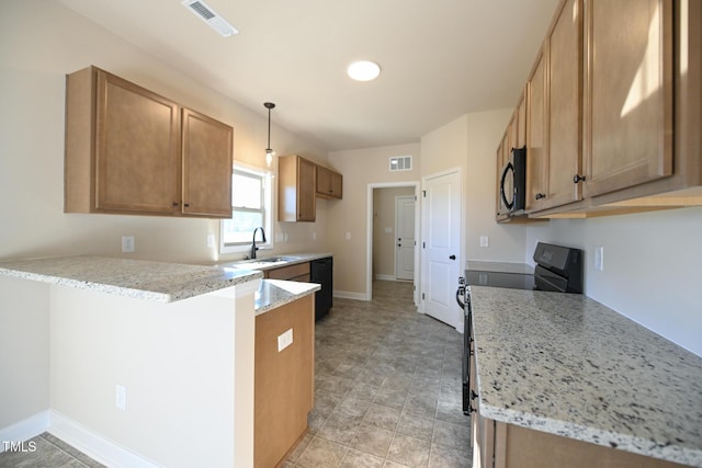 kitchen with black appliances, sink, decorative light fixtures, light stone counters, and kitchen peninsula