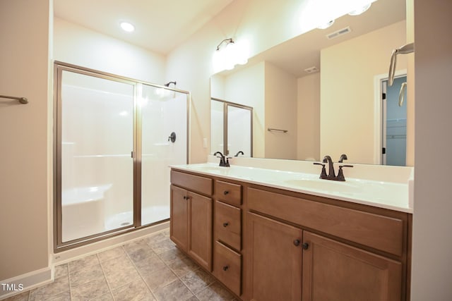 bathroom featuring vanity and walk in shower