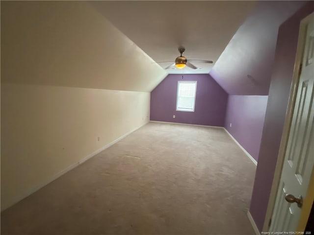 bonus room featuring ceiling fan, carpet, and lofted ceiling